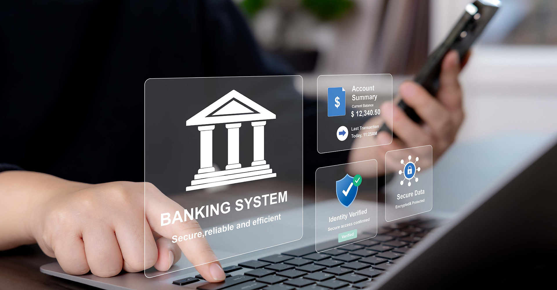 A close-up of a man typing on a black laptop shows a login screen pop up for a banking system, as well as a shield and account balances.